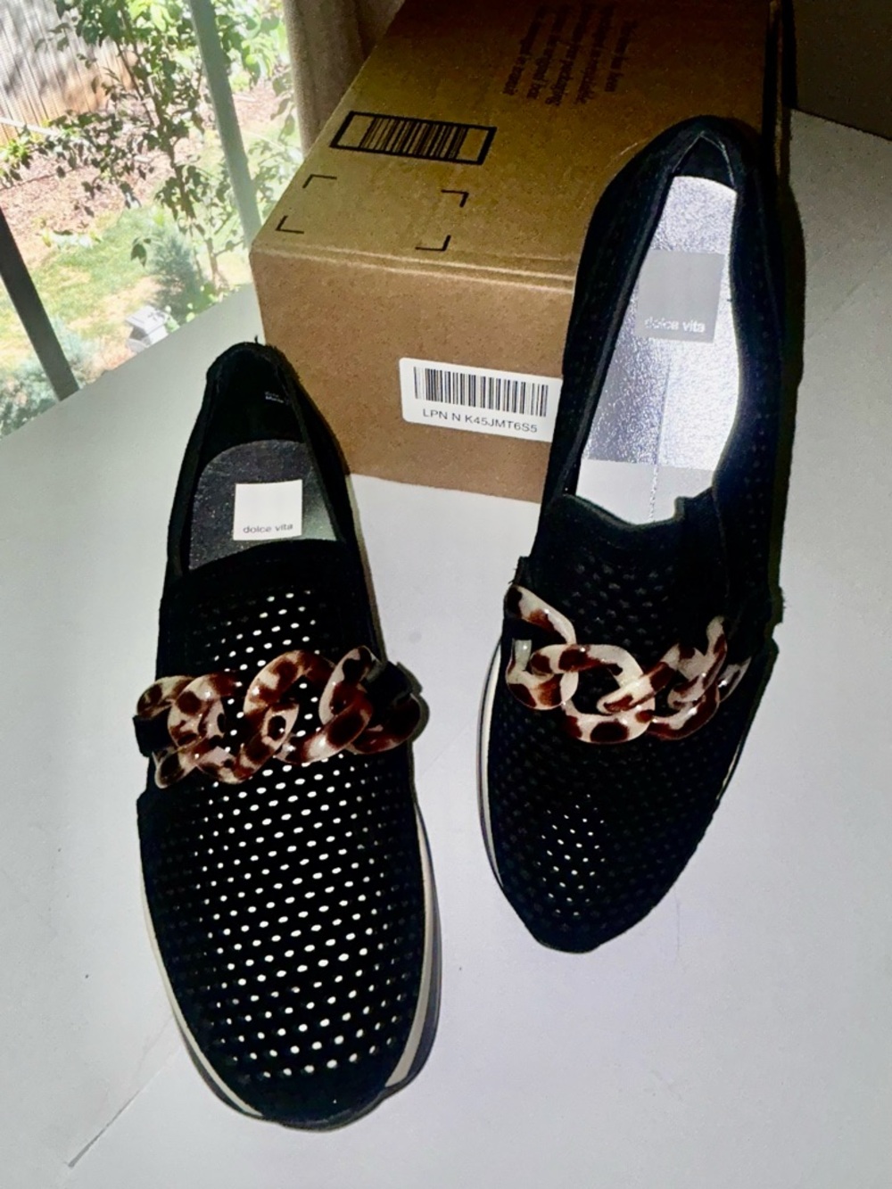 Dolce Vita Black Perforated Slip-On Loafers with Tortoiseshell Chain Accent